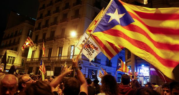 Protestors wave Catalan separatist flags following a demonstration on the first anniversary of Catalonia’s banned independence referendum in Barcelona, on Monday. Photograph: Enrique Calvo/Reuters