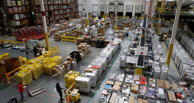 Amazon’s pay rise helps to address growing discontent at working conditions in its network of logistics warehouses. Photograph: AP
