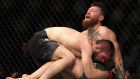  Khabib Nurmagomedov  holds down Conor McGregor during their UFC lightweight championship bout at UFC 229  in Las Vegas. Photograph: Harry How/Getty Images