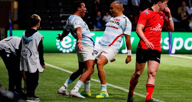 Racing 92’s French winger Teddy Thomas  celebrates with  Simon Zebo  after scoring a try against Ulster in Paris. Photograph:  Geoffrey Vand der Haselt/AFP/Getty