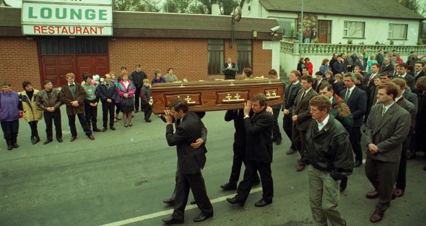 The funeral of Greysteel massacre victim Steven Mullan passes the Rising Sun bar where the atrocity took place. Photograph: Pacemaker