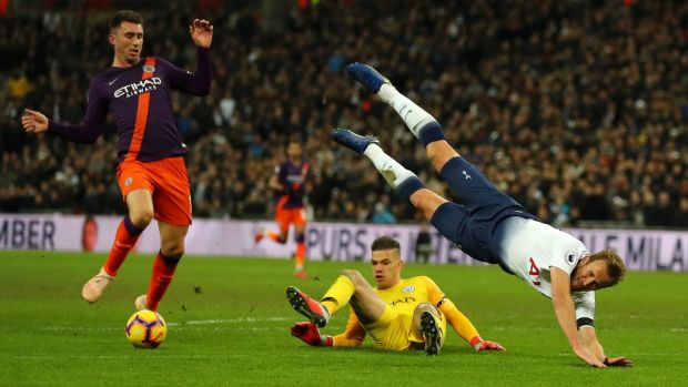 Harry Kane of Tottenham Hotspur is challenged by Manchester City goalkeeper Ederson during the Premier League match at Wembley stadium. Photograph: Catherine Ivill/Getty Images