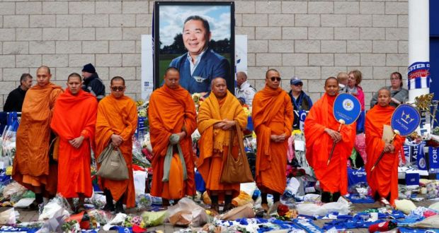Bhuddhist monks stand in tribute after the Leicester’s owner Thai businessman Vichai Srivaddhanaprabha, and four other people died when their helicopter crashed as it left the King Power stadium after the match on Saturday. Photo: Eddie Keogh/Reuters