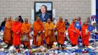 Bhuddhist monks stand in tribute after the Leicester’s owner Thai businessman Vichai Srivaddhanaprabha, and four other people died when their helicopter crashed as it left the King Power stadium after the match on Saturday. Photo: Eddie Keogh/Reuters
