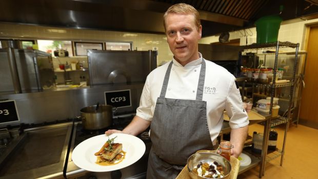 Tony Connor, head chef at the FoodSpace-operated cafe at Backweston Laboratory Campus in Co Kildare, with lunch dishes of roast pork belly, and vegetarian pakoras with chutney. Photograph: Lorraine O’Sullivan.