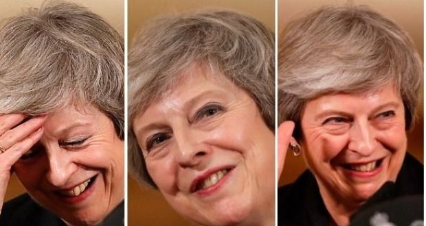  Theresa May reacts during a news conference at Downing Street in London. 