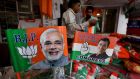 Election material with pictures of Indian prime minister Narendra Modi and Congress party president Rahul Gandhi in a shop in Bhopal. Photograph: Sanjeev Gupta/EPA