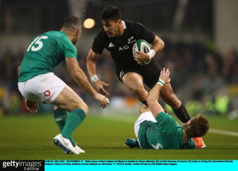 Rieko Ioane of New Zealand  is tackled by Kieran Marmion as Rob Kearney moves in. Photograph: Phil Walter/Getty Images
