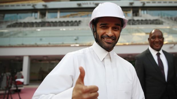 Hassan Al Thawadi, the secretary general of the Qatar’s Supreme Committee for Delivery and Legacy (SC) presents a solar powered helmet for the stadium workers. Photo: Alex Grimm/Bongarts/Getty Images