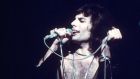 Circa 1975: Freddie Mercury in concert during the Queen’s British tour. Photograph: Keystone/Getty Images.