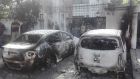Pakistani security personnel stand next to burned out vehicles in front of the Chinese consulate after an attack in Karachi. Photograph: Asif HassanAFP/Getty Images