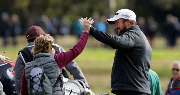 Shane Lowry is congratulated by a walking scorer after he made a hole in one on the fifth during the second round of the British Masters. Photo: David Cannon/Getty Images