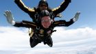  Former US president George HW Bush (bottom) celebrates his 85th birthday by jumping with the US army’s Golden Knight parachute team in a tandem jump with SFC Michael Elliott in Kennebunkport, Maine in  2009. Photograph: Reuters 