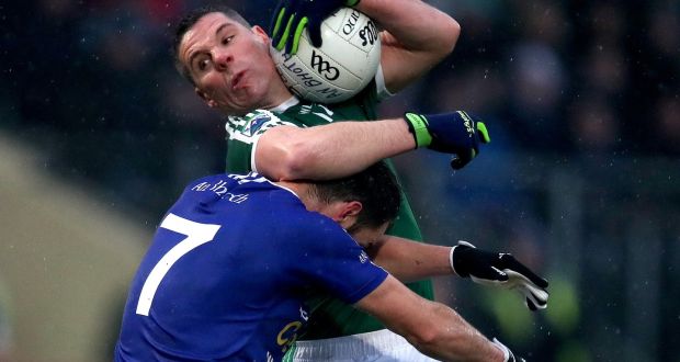 Gaoth Dobhair’s Kevin Cassidy is tackled by Scotstown’s Emmet Caulfield during the Ulster club football final at Healy Park. Photograph: Bryan Keane/Inpho