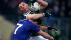 Gaoth Dobhair’s Kevin Cassidy is tackled by Scotstown’s Emmet Caulfield during the Ulster club football final at Healy Park. Photograph: Bryan Keane/Inpho