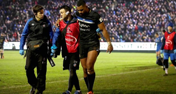 Bath’s Joe Cokanasiga goes off injured during the Heineken Champions Cup game against Leinster at the Recreation Ground. Photograph: Ryan Byrne/Inpho