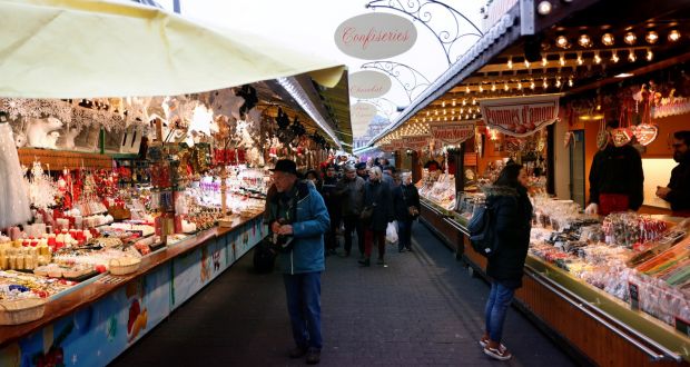 People visit the Christmas Market, in Strasbourg, France, on Friday. Photograph: EPA
