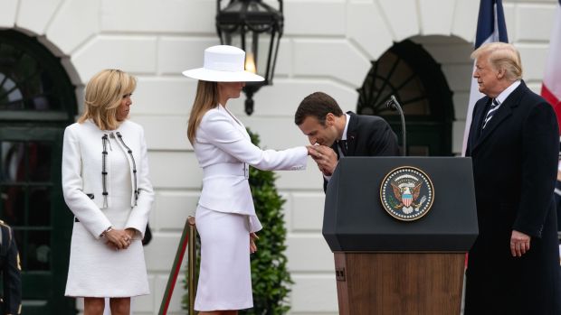 French President Emmanuel Macron kisses Melania’s hand. Photograph: Cheriss May/NurPhoto via Getty Images