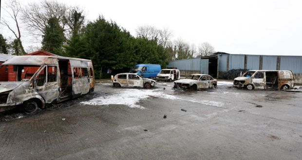 Burnt out vans and cars at  the house which was the scene of the  eviction in Strokestown. Photograph: Brian Farrell