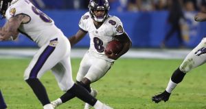  Baltimore Ravens quarterback Lamar Jackson runs with the ball on a broken play during the game against the Los Angeles Chargers at the StubHub Center in Carson, California. Photograph: Peter Joneleit/EPA