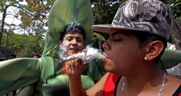 A man smokes a joint during a rally in support of the legalisation of marijuana in Guadalajara, Mexico. Photograph: Ulises Ruiz/AFP/Getty Images