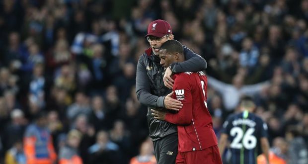Liverpool manager Jurgen Klopp embraces Georginio Wijnaldum after another impressive display. Photograph: Rich Linley/Getty 