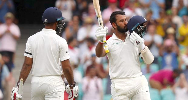 India’s Cheteshwar Pujara celebrates his century on the opening day of the final Test against Australia in Sydney. Photograph: David Gray/AFP/Getty