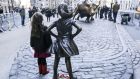 The Fearless Girl and  Charging Bull statues on Wall Street in New York. Photograph: William Volcov/Getty Images
