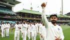  India’s captain Virat Kohli gestures as the India team celebrates their series win on the fifth day of the fourth   Test at the Sydney Cricket Ground. Photograph: Peter Parks/AFP/Getty Images