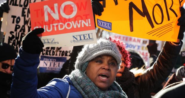 Federal workers and contractors rally against the partial federal government shutdown. Photograph: Chip Somodevilla/Getty Images