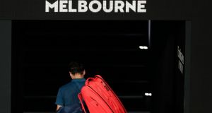 Roger Federer leaves the court after his defeat in Melbourne. Photograph: Lynn Bo Bo/EPA