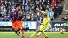 Manchester City’s Leroy Sané scores his side’s third goal  during the Premier League match against Huddersfield at the John Smith’s Stadium. Photograph:  Martin Rickett/PA Wire