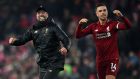 Liverpool’s  manager Jürgen Klopp celebrates with Liverpool’s English midfielder Jordan Henderson on the pitch after Liverpool’s 4-3 defeat over Crystal Palace at Anfield on Saturday. Photograph: Paul Ellis/AFP/Getty Images