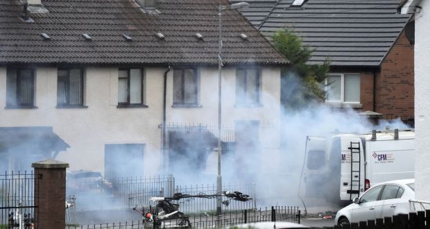 Army bomb disposal robots are seen next to a  vehicle as a controlled explosion takes place at the scene of a security alert in Derry. Photograph: Clodagh Kilcoyne/Reuters