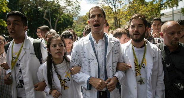 Opposition National Assembly leader Juan Guaidó, who declared himself interim president of Venezuela last week, taking part in a protest against Nicholás Maduro in Caracas on  Wednesday. Photograph: Rodrigo Abd/AP
