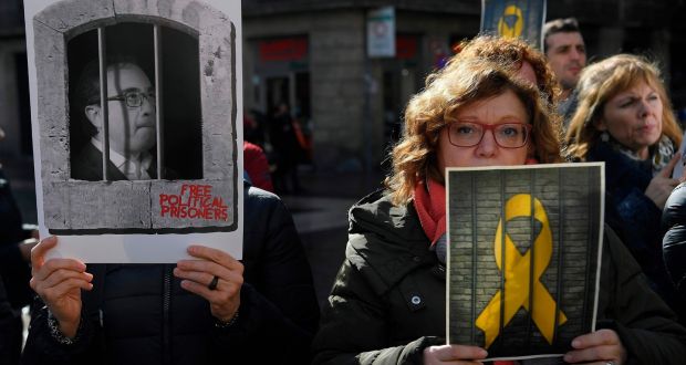 Pictures of jailed Catalan pro-independence leaders are held up during a demonstration in Barcelona, on Friday, in support of 12 pro-independence leaders that were transferred from Barcelona to Madrid ahead of the start of their trial. Photograph: Lluis Gene/AFP/Getty Images