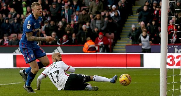 David McGoldrick slides home  Sheffield United’s first goal in the Sky Bet Championship match against  Bolton Wanderers at Bramall Lane. Photograph: Nigel Roddis/Getty Images