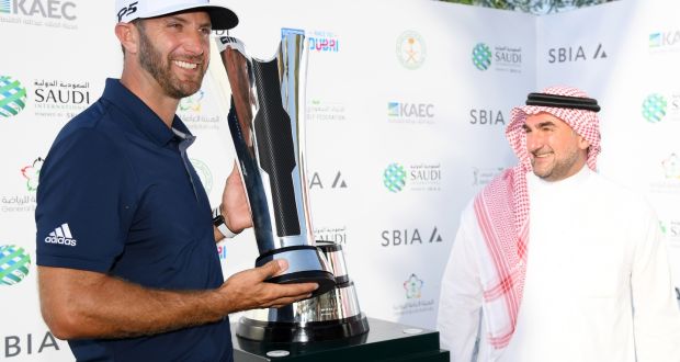 Dustin Johnson with the trophy after his European Tour win in Saudi Arabia. Photograph: Ross Kinnaird/Getty