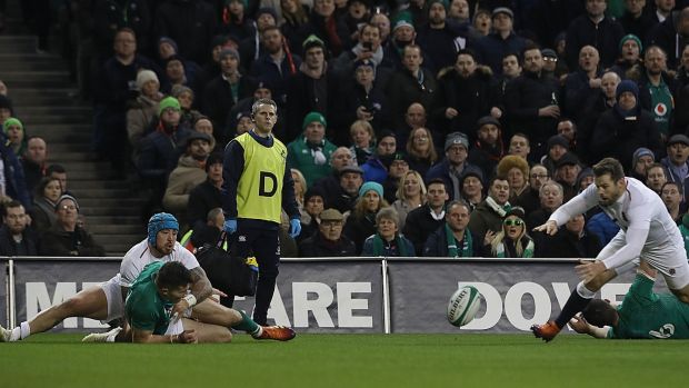 England’s Elliot Daly scores a try after a mistake by Ireland’s Jacob Stockdale during the Six Nations clash at the Aviva Stadium. Photograph: Lorraine O’Sullivan/PA