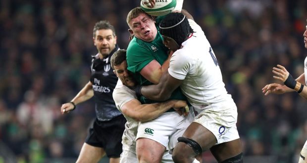 Tadhg Furlong’s progress is halted by the combined tackles from  England’s Mark Wilson and Maro Itoje during the Six Nations clash at the  Aviva Stadium. Photograph: Billy Stickland/Inpho