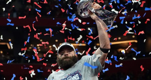 New England Patriots wide receiver Julian Edelman holds the trophy as he celebrates their Super Bowl win against the Los Angeles Rams at Mercedes-Benz Stadium in Atlanta, Georgia. Photograph:   Timothy A Clary/AFP/Getty Images