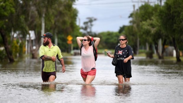 Residents of Townsville in north Queensland have begun cleaning up after days of torrential rain and unprecedented water releases from the city’s swollen dam, sending torrents of water down the Ross River and into the city, swamping roads, yards and homes. Photograph: Dan Peled/EPA