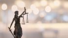 Justice law legal concept. statue of justice or lady justice with bokeh background.
