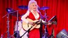 Dolly Parton sings at the  Red Tent Women’s Conference 2014 in Nashville, Tennessee in 2013. Photograph: Getty Images