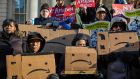Protesters opposed to Amazon’s  New York campus on the steps of city hall in New York. Photograph: Hiroko Masuike/The New York Times