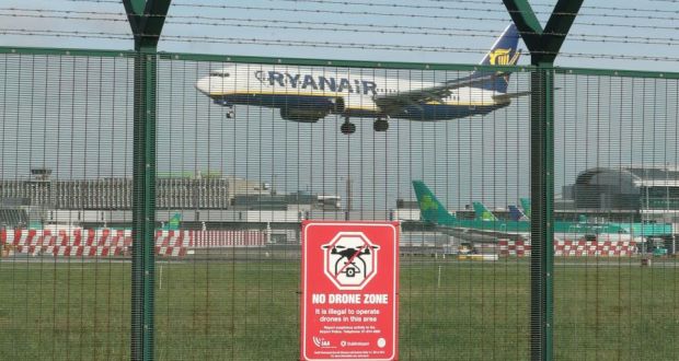 A no drone zone sign is pictured on the perimeter fence of the Dublin Airport airfield after  the temporary suspension of operations at the airport following a drone sighting on Thursday. Photograph: Nial Carson/PA Wire 
