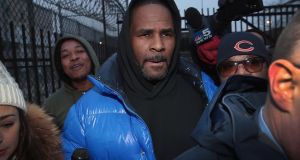R&B singer R. Kelly leaves the Cook County jail after posting $100,000  bond Photograph: Scott Olson/Getty Images