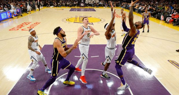 LeBron James of the Los Angeles Lakers scores to pass Michael Jordan and move to fourth on the NBA’s all-time scoring list. Photograph: Robert Laberge/Getty Images