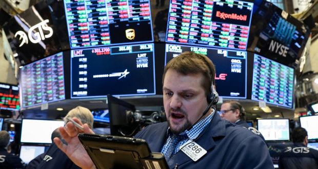Traders work on the floor of the New York Stock Exchange, on Thursday. Wall Street fell for the fourth straight session, weighed down by financial and technology stocks. Photograph: Brendan McDermid/Reuters