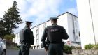 Police outside  Glin Ree Court in Newry, Co Down, where the bodies of a man, a woman and a teenage girl were discovered on Thursday.  Photograph:  Niall Carson/PA 